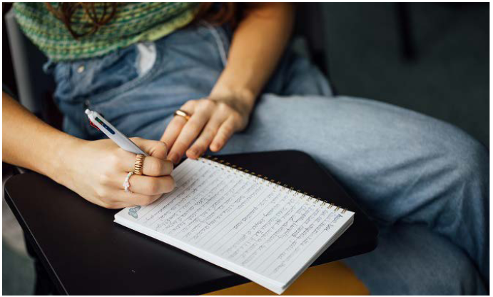 student taking notes