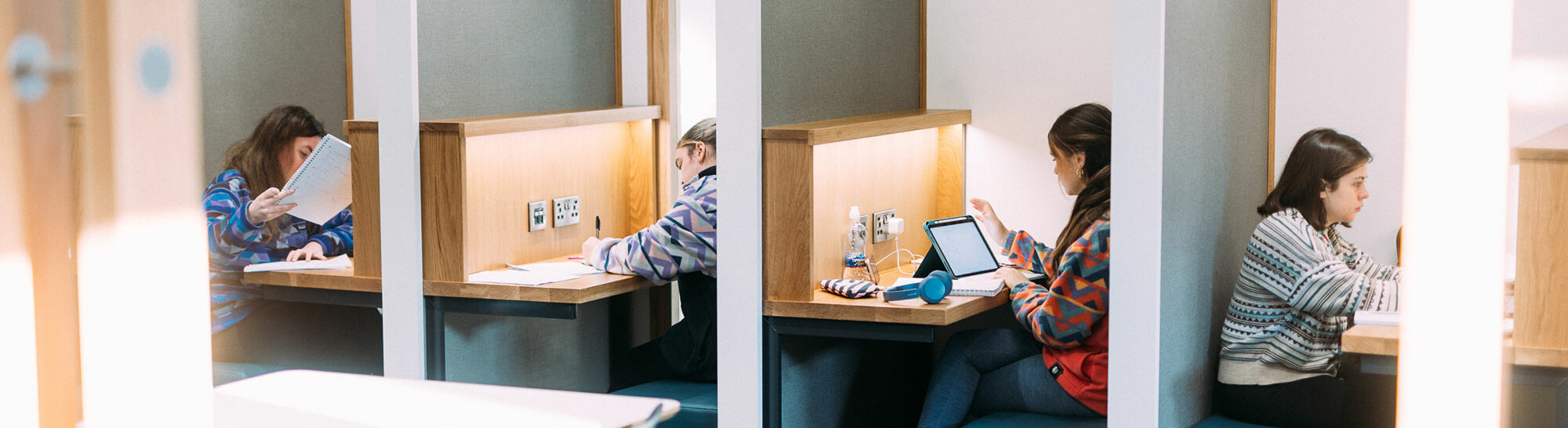 Students studying at the Cardinal Newman library