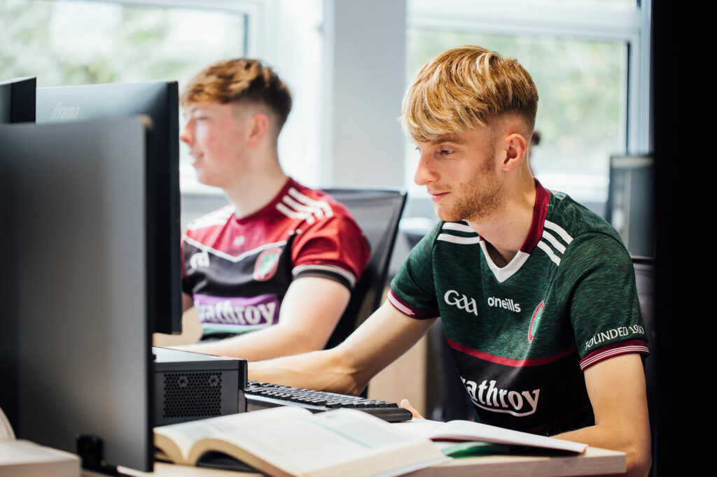 maths students working at PC terminals