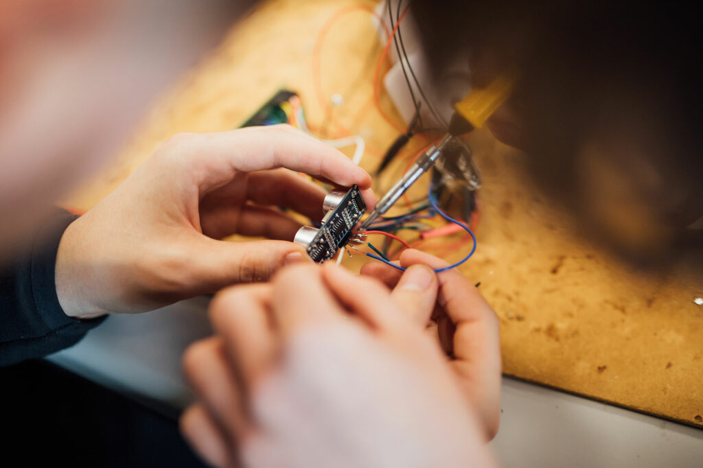 Technology & Design student working on circuit board, entry requirements