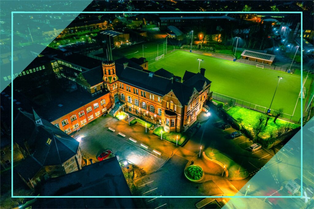 aerial view of college showing floodlit pitches