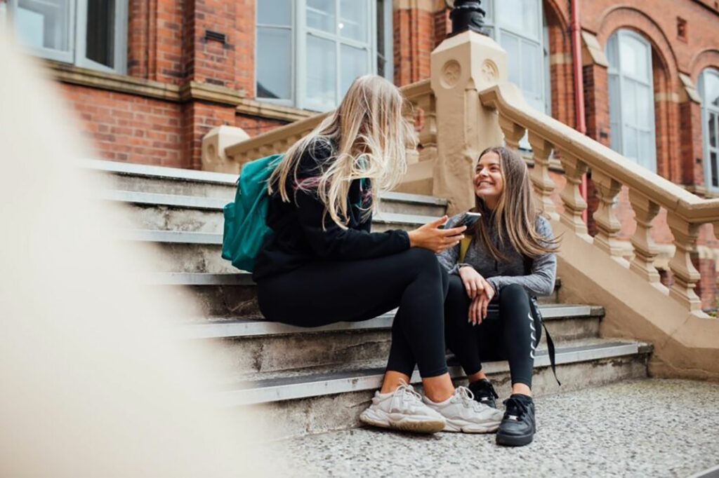 St Mary’s students socialising on College steps