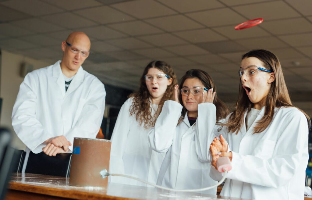 Science students undertaking an experiment in class