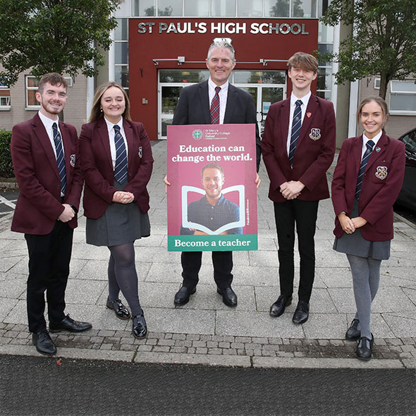 The Principal Jarlath Burns with students from St Pauls High School