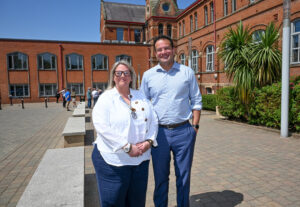 Former Taoiseach Leo Varadkar with Baptist Minister Reverend Karen Sethuraman standing out in the front of St Mary's University College Belfast