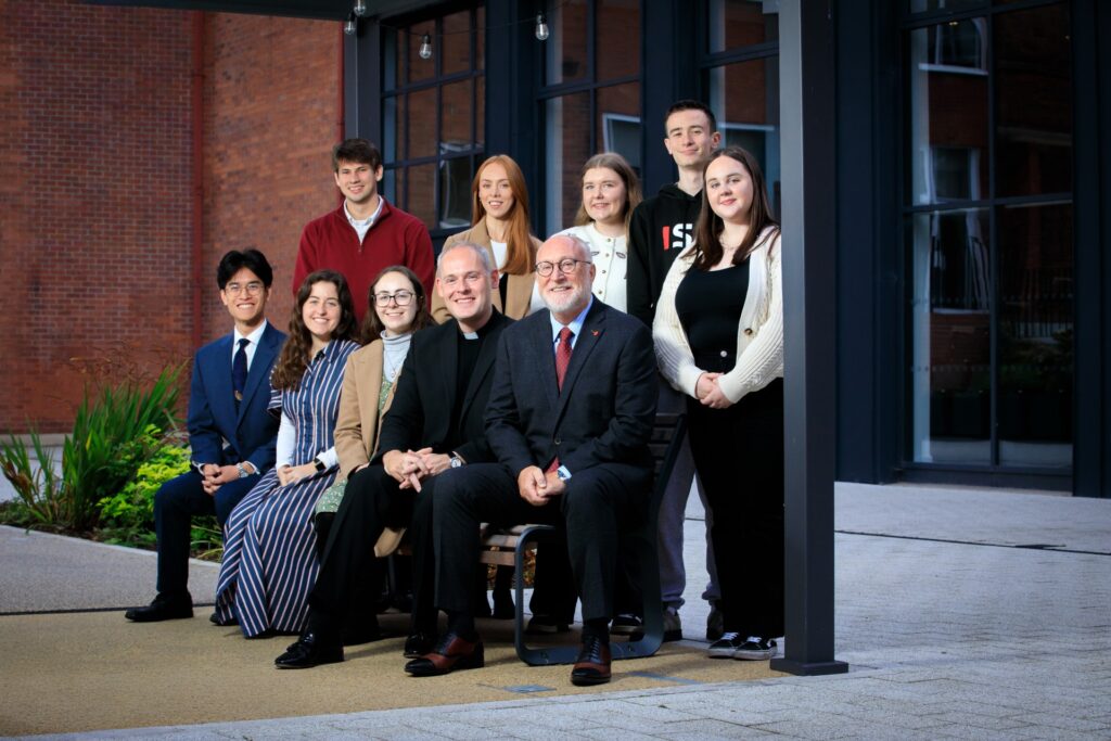 Professor Peter Finn with parish priest, students and lecturers in the st mary's quad