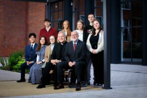 Professor Peter Finn with parish priest, students and lecturers in the st mary's quad